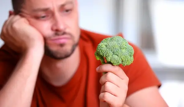 Is Broccoli Good For Weight Loss? person holding a broccoli